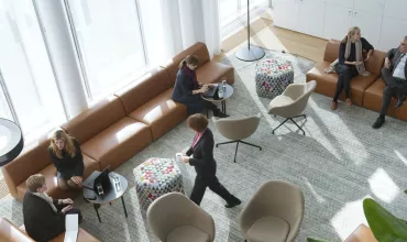 Groups of people in discussion in a lounge on Novartis Campus