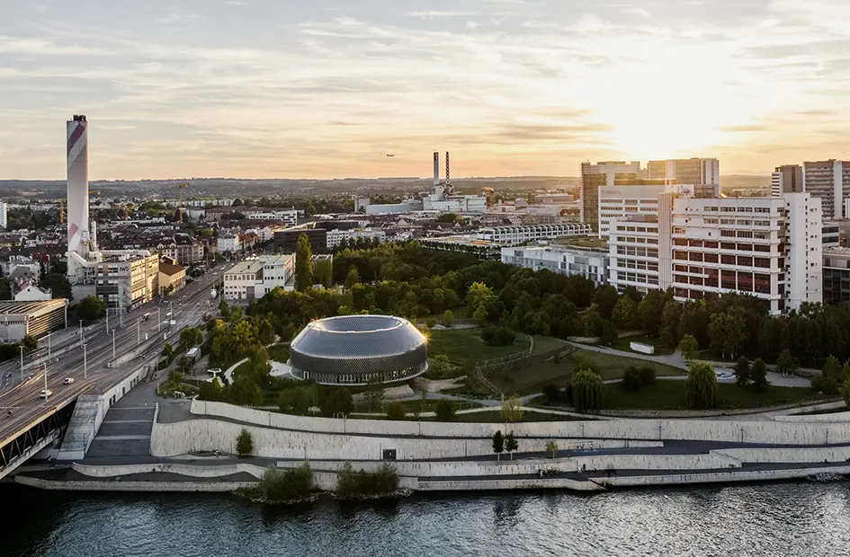 basel-city-with-river-and-the-Novartis-campus-at-sunset.png